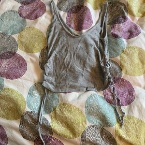a grey tank top with ties on both sides
